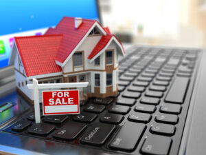 Real estate agency online. House on laptop keyboard. 3d